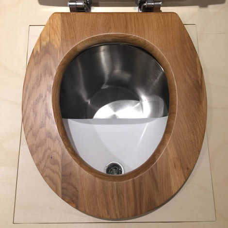 Les toilettes sèches adaptables d'intérieur et son séparateur d'urine